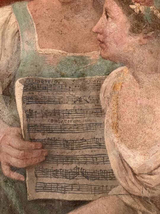 A close-up of a painting of a sheet of music.