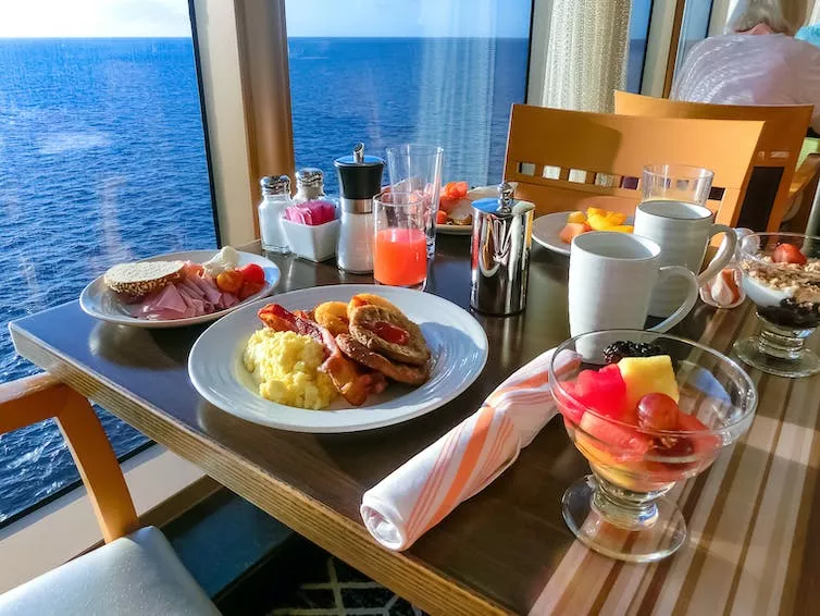 A table with buffet food on a ship.